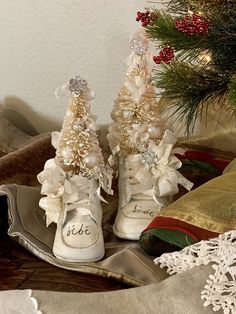 pair of white sneakers decorated with christmas trees