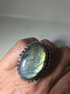 Vintage Large Labradorite Rainbow Moonstone Stone Silver Ring https://www.etsy.com/listing/540531388/vintage-large-labradorite-rainbow?utm_source=crowdfire&utm_medium=api&utm_campaign=api Antique Oval Moonstone Ring Handmade, Handmade Antique Oval Moonstone Ring, Vintage Oval Labradorite Jewelry, Unique Handmade Oval Cabochon Moonstone Ring, Handmade Unique Oval Moonstone Ring, Vintage Labradorite Rings For Gift, Handmade Silver Moonstone Ring For Healing, Vintage Moonstone Ring With Large Stone As Gift, Vintage Moonstone Ring With Large Stone For Gift