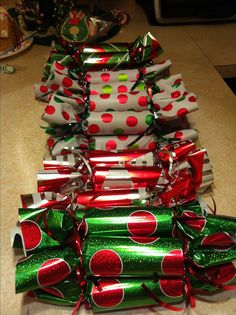 a stack of wrapped presents sitting on top of a counter