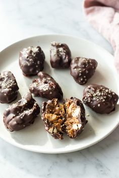 chocolate covered candies on a white plate