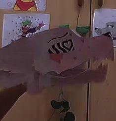 a piece of paper that has been cut out to look like a fish with numbers on it