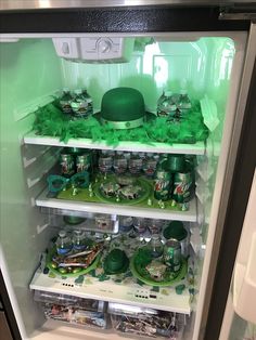 an open refrigerator filled with lots of green items