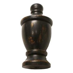 a wooden chess piece on a white background