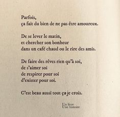 an open book with writing in french on the page and two birds flying over it