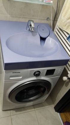 a washer and dryer in a small room