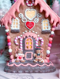 a gingerbread house decorated with candy and decorations