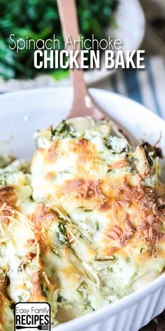 spinach artichoke chicken bake in a white casserole dish