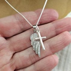 Solid 925 Sterling Silver Angel wing charm necklace- A wonderful Sympathy gift for the loss of a loved one Sterling Silver Angel Wing with CZ's measures 28mm (just over 1 inch) Sterling Silver Cross measures 25mm (1 inch)  Sterling Silver 0.8mm Cable or Box Chain with spring ring clasp.  (You choose style and length using the drop down menu) Comes beautifully packaged - ready to give as a gift or keep for yourself! Add a Swarovski Birthstone dangle charm using this link: https://forevermemorydes Sterling Silver Charm Necklace For Memorial, Sterling Silver Necklace For Remembrance, Sterling Silver Cross Pendant Necklace For Memorial, Sterling Silver Cross Charm Necklace For Anniversary, Spiritual Sterling Silver Charm Necklaces For Keepsake, Spiritual Sterling Silver Charm Necklace For Keepsake, Memory Design, Wattpad Cover, Silver Angel Wings