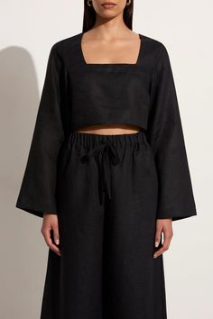 Designed for easy wear, the Eilish Top in Black is your summer linen essential. This long sleeve crop top is crafted from responsibly sourced linen and features a relaxed silhouette, square neckline and flared long sleeves. Style it with black linen trousers for an elevated set. Black Linen Top, Linen Skirt Outfit, White Linen Outfit, Linen Long Sleeve Top, Black Linen Trousers, Flare Long Sleeve, Sleeves Style, Maxi Dress Sale, Summer Linen