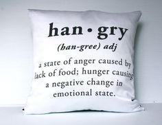 a white pillow with black writing on the front and back of it that says, han - gry