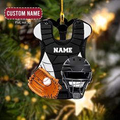 a baseball ornament with a catchers mitt and glove hanging from a christmas tree