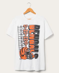 Go the distance in Cincinnati fashion with our Bengals Yardage Flea Market Tee! Embrace the gridiron greatness with this uniquely designed shirt that celebrates your team's history and achievements. A winning combination of comfort and style, it's perfect for any Bengals fan looking to stand out on game day! Shop the rest of our NFL Collection HERE. Bengals Jersey, Nfl T Shirts, Go The Distance, Food Clothes, Cincinnati Bengals, Shirt Sale, Mens Graphic Tee, Flea Market, Cincinnati