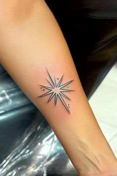 Starburst tattoo with geometric lines and small dots on a person's forearm. Moravian Star Tattoo, A Star Tattoo, Moravian Star, Hand And Finger Tattoos, Nautical Star