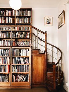 the bookshelves are full of books in this room