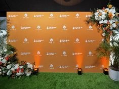 an event backdrop with flowers and candles on the grass