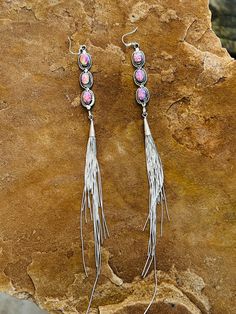 These Fringe Barbie Drop Earrings make any outfit stand out. Crafted from cultured pink, these fringe earrings are sure to add a dash of style to your wardrobe. An exciting take on traditional earrings, these pieces will help you make a statement. Sterling silver and made in the USA! Silver Fringe Drop Earrings, Silver Long Drop Earrings With Tassels, Silver Fringe Long Drop Earrings, Silver Dangle Earrings With Tassels, Pink Fusion Dangle Jewelry, Pink Fusion Style Dangle Jewelry, Fusion Style Pink Dangle Jewelry, Pink Fringe Earrings For Festival, Pink Latkans Earrings For Festival