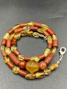 Ancient crystals and Agate jasper beads necklace from my old collections The necklace is the combination of old agate jasper and yellow color crystals rock beads which found in India but this kind of beads mostly found in central Asia countries as well they were used to be a protective beads very good condition and beautiful agate jasper 10 pictures available which you can swipe to see the details of this beautiful necklace we provide fast and free shipping service world wide Polished Amber Beads For Jewelry Making, Handmade Amber Round Beads, Handmade Amber Beads, Amber Beaded Necklaces With Natural Stones For Healing, Hand-strung Amber Oval Beads, Amber Carnelian Beads, Gems, And Cabochons, Amber Gemstone Beads For Jewelry Making, Amber Natural Stones Round Beads, Amber Oval Beads Necklace For Jewelry Making