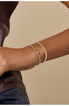 Designed to skillfully adapt to the curves of the wrist, this slender cuff is crafted from hand-coiled strands of 18-karat gold. The versatile piece is punctuated with three diminutive stations dusted in pavé diamonds. 6 3/4" inner circumference; 1/8" width; 1/8" square stations Box clasp with hinge closure Total diamond weight: 0.09ct Color: G Clarity: VS1 Made in Italy Diamond Guide Gold Double Band Bracelet For Formal Occasions, Gold Double Band Bracelets For Formal Occasions, Elegant Double Band Gold Bracelets, Elegant Double Band Gold Cuff Bracelet, Elegant Gold Double Band Cuff Bracelet, Elegant Double Band Adjustable Bracelets, Elegant Double Band Yellow Gold Jewelry, Elegant Double Band Bracelets For Formal Occasions, Elegant Double Band Formal Bracelets