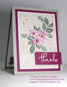 a close up of a card with flowers and leaves on the front, thank you