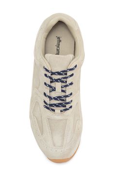 Layered panels with curved lines give a retro vibe to this low-profile sneaker featuring zesty contrast laces. Lace-up style Leather upper/textile lining/synthetic sole Imported White Sporty Sneakers With Front Lace-up, White Sporty Lace-up Sneakers, Spring High-top Sneakers With Lace-up Fastening, Spring High-top Sneakers With Front Lace-up Fastening, High-top Sneakers With Front Lace-up For Spring, High-top Sneakers With Front Lace-up Fastening For Spring, Casual Leather Sneakers With Lace-up Fastening, Lace-up Sneakers For Jogging, Casual Leather Lace-up Sneakers