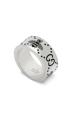 GUCCI Signature Silver Ring with Bee Motif YBC728304001The historical GG motif appears alongside a favourite House symbol, the bee. The contemporary feel to the design echos the gender-fluid approach that is seen throughout the collection. The two engraved emblems feature as the defining design d... House Symbol, New Taiwan Dollar, Gender Fluid, Gold Ounce, The Bee, The Collection, Design Details, Silver Ring, Sterling Silver Rings