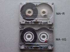 two cassettes are stacked on top of each other and labeled with the names ma - xg