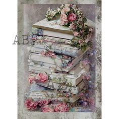 a stack of books with flowers on top