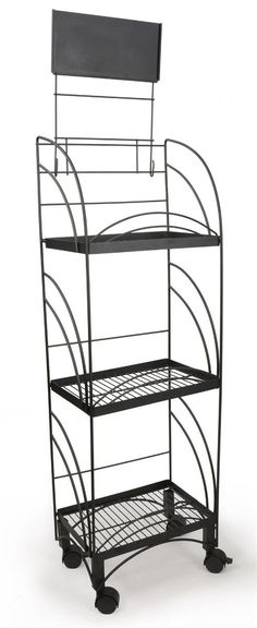 a three tiered metal shelf on wheels with a sign hanging from the top and bottom