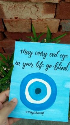 someone is holding up a card that says may every evil eye be in your life go blind