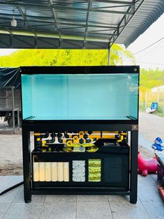 an outdoor stand with food and drinks on it