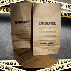 two brown paper bags with evidence taped around them