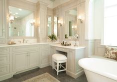 a large bathroom with two sinks and a bathtub