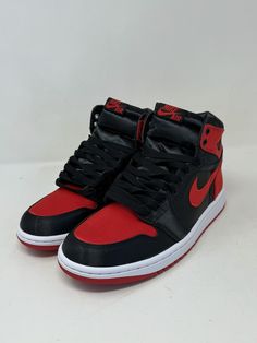 The Air Jordan 1 Retro OG 2023 High Satin Bred W is a women's athletic sneaker with a high top shoe shaft style, red satin upper material, and a black and red colorway. It has a style code of FD4810-061 and a US shoe size of 9.5. The shoe is designed for boxing performance and is part of the Air Jordan product line. It comes brand new with the original box. University Red High-top Sneakers With Laces, High-top Synthetic Jordan Shoes With Red Sole, High-top Jordan Shoes With Red Sole, Custom High-top Sneakers With Red Sole For Training, Red Sole High-top Sneakers For Training, High-top Custom Sneakers With Red Sole, Red High-top Training Sneakers, Red-sole High-top Training Sneakers, Red Synthetic High-top Sneakers