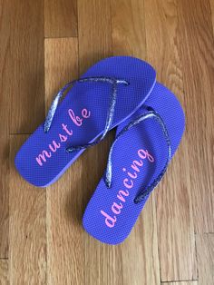 "These DECALS are the perfect way to dress up a dancer's flip flops They make a perfect gift too Ballerinas on Canvas aims to create new items for dancers PRODUCT **Listing is for DECAL ONLY **FLIP FLOPS ARE NOT INCLUDED.** Made of quality vinyl in a variety of colors. Each order is for 1 \"must me\" \"dancing\" decal and largest area measures approx. 5.25 x 1.5 inches SHIPPING All orders ship out within 1-2 weeks. However, in most cases, orders ship out within a few days. If you have a specific Adjustable Purple Flip Flops For Summer, Adjustable Purple Round Toe Flip Flops, Dance Ornaments, Purple Flip Flops, Dance Crafts, Dance Stuff, Cute Water Bottles, Dance Mom, Dance Teacher