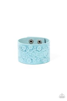 A flowery and leafy motif blooms across the front of a distressed blue leather band, resulting in a rustic floral centerpiece around the wrist. Features an adjustable snap closure. Sold as one individual bracelet.