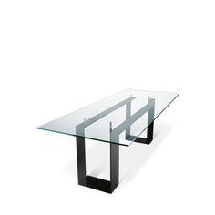 a glass table with black metal legs