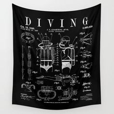 a black and white wall hanging tapestry with an old diving gear diagram on it's side