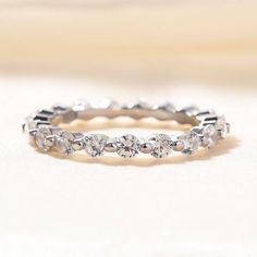 a white gold wedding band with round cut diamonds