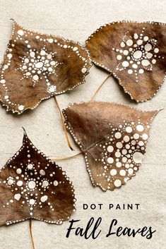 four leaves with white dots on them and the words dot paint fall leaves written below