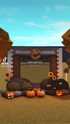 an animated image of pumpkins and other decorations in front of a small building with a wreath on it