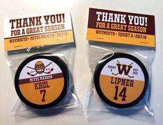 two hockey pucks with thank you for a great season written on the front and back