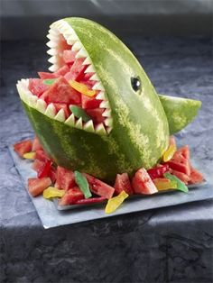 a watermelon shaped like a shark with its mouth open