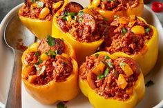 several stuffed peppers on a white plate