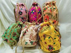 "Lot Of 100 Indian Handmade Women's Embroidered Clutch Purse Potli Bag Pouch Drawstring Bag Wedding Favor Return Gift For Guests Free Ship. PRODUCT DETAIL :- -------------------------- Product Item : Embroidered Potli Bags with Pearl Strap Size : 6x8\" inches approx Product Line: Rajasthani Ethnic Women Handbag Potli Bags Material -: Fabrics, Beads Occasion: Any Occasion, Festive, Party, Wedding, Bridal PRODUCT DESCRIPTION :- This colorful Clutch Purse with vibrant colors & ethnically design Multicolor Handwork Bags For Celebration, Multicolor Handwork Pouch For Celebration, Multicolor Handwork Bags For Wedding, Multicolor Handwork Wedding Bag, Celebration Multicolor Handwork Pouch, Multicolor Bags With Zari Work For Celebrations, Multicolor Handwork Pouch For Gift, Festive Floral Embroidered Potli Bag, Festive Floral Embroidery Potli Bag