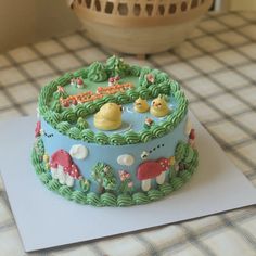 a decorated cake sitting on top of a table