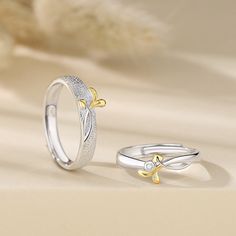 This Custom Engraved Mori Leaf Matching Rings Set for Couples is exquisitely crafted, with adjustable sizes allowing for a comfortable fit and beautiful wedding and promise rings. This set is perfect for couples wishing to express their love and commitment. Material: Gold Plated 925 Sterling Silver + Cubic Zirconia Adjustable Silver Couple Rings For Valentine's Day, Silver Adjustable Flower Ring For Wedding, Valentine's Day Wedding Couple Open Rings, Adjustable Couples Rings For Valentine's Day, Adjustable Couples Promise Rings, Couples' Adjustable Silver Rings, Adjustable White Flower Promise Ring, Adjustable White Gold Flower Ring For Anniversary, Adjustable White Gold Flower Ring For Promise