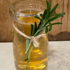 a glass jar filled with liquid sitting on top of a table