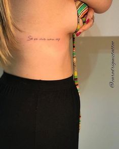 the back of a woman's stomach with an inscription on it that says, she is