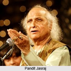 an old woman standing in front of a microphone