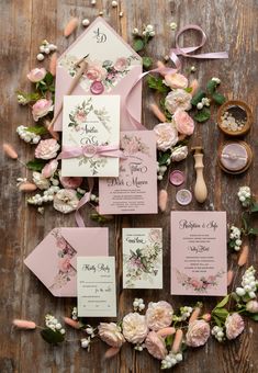 pink wedding stationery with flowers and ribbons